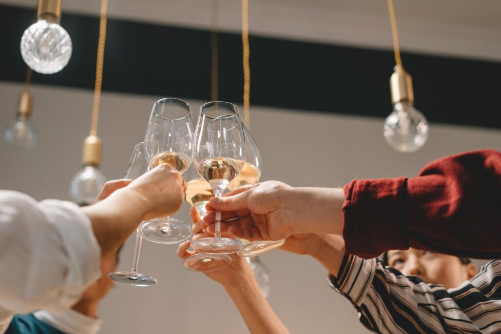 People celebrating an engagement, representing the financial planning conversation every couple should have
